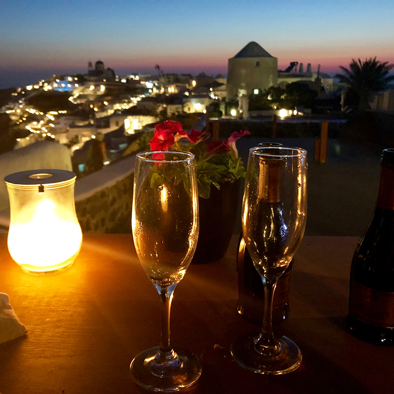 Romantic view from Mes Amis Restaurant and glasses of champange at night